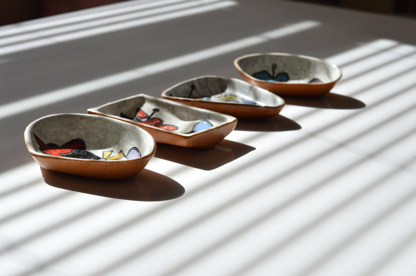 1950s– Set of 4 Signed Italian Leather Clad Ceramic Dishes