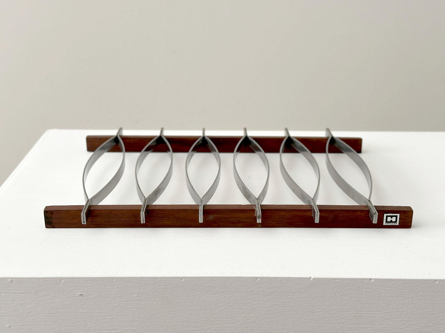 1960s – Mid-Century Brazilian stainless steel and rosewood trivet by Hercules