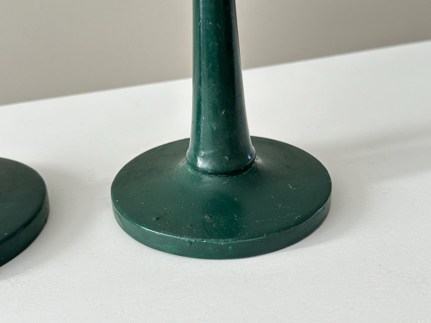 Pair of antique half inch tapered candlestick holders with green paint, imperfect and rustic