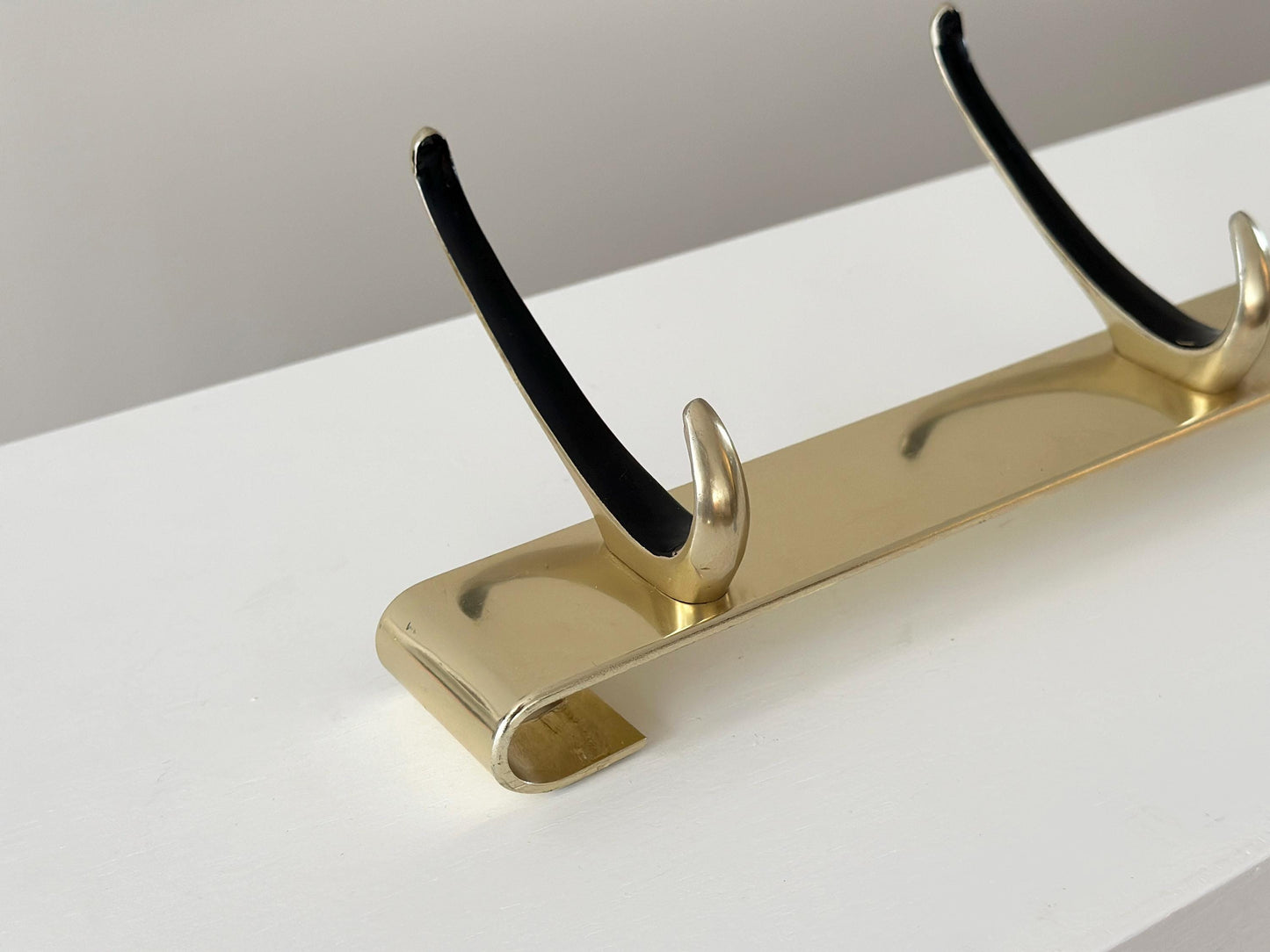 1960s – Mid-Century gold wall hooks coat rack with black accent with 3 hooks