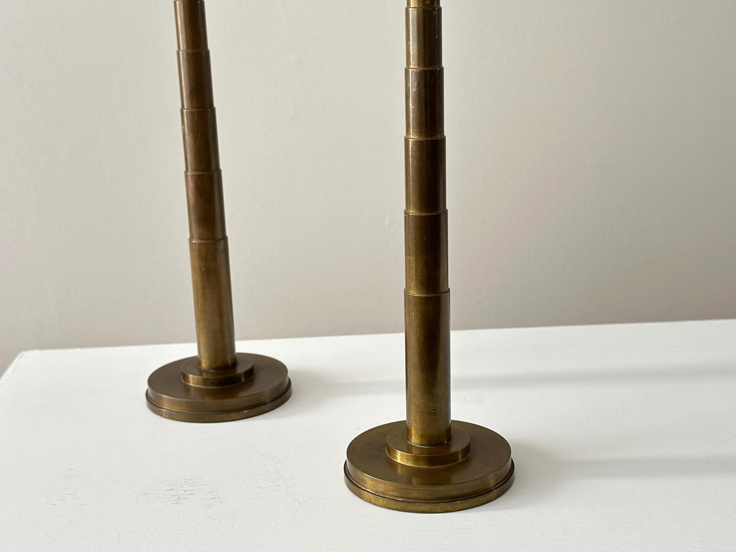1930s – Pair of solid brass Art Deco candleholders with tiered stepped design