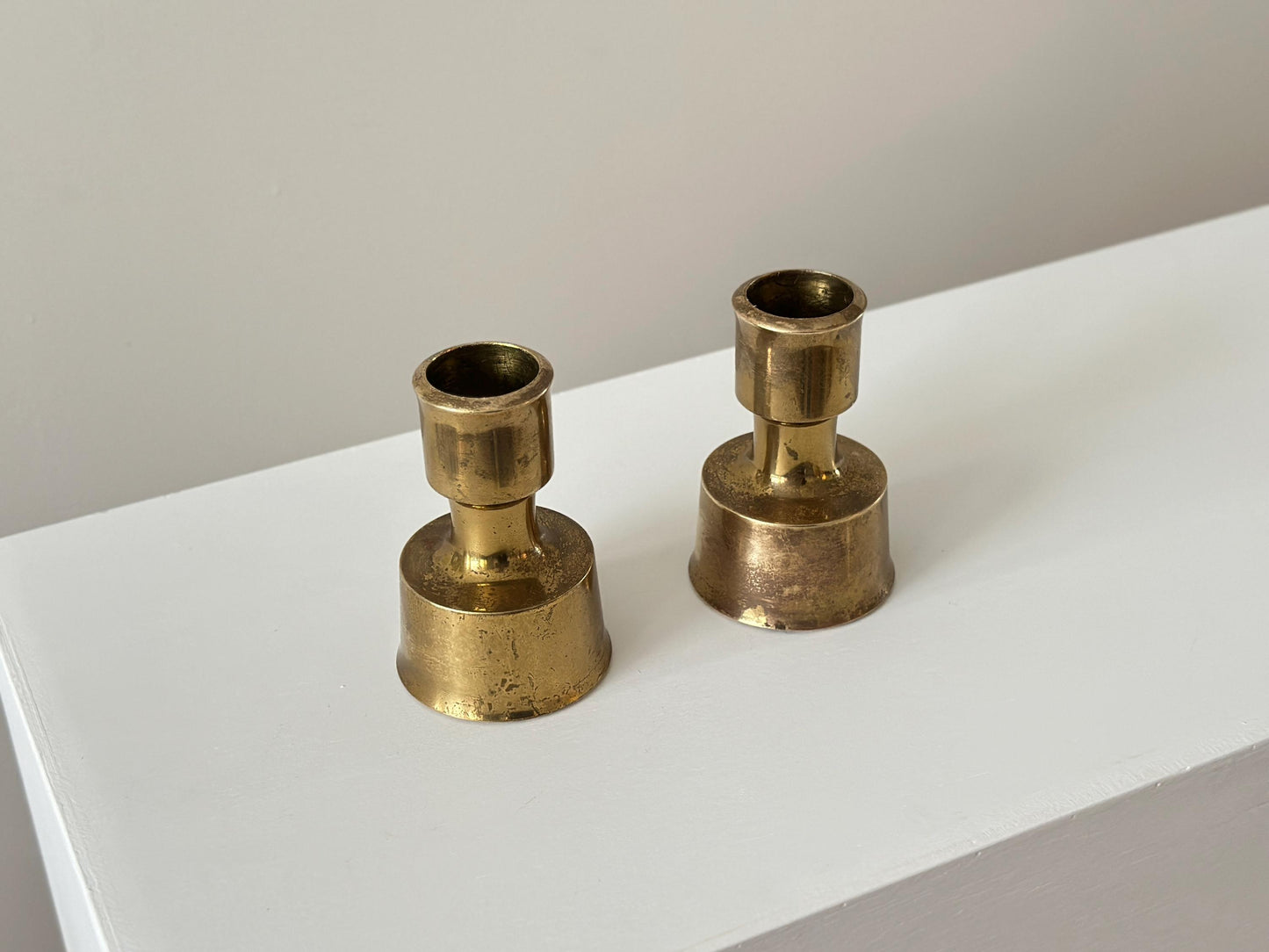 1950s – Solid brass candle holders by Jens Harald Quistgaard for Dansk. Produced in Finland.