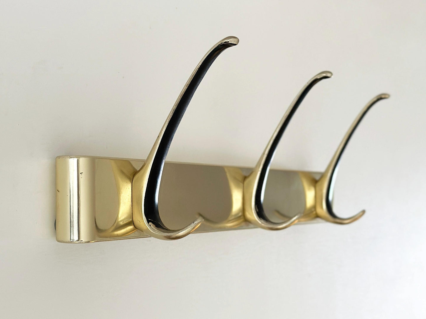 1960s – Mid-Century gold wall hooks coat rack with black accent with 3 hooks