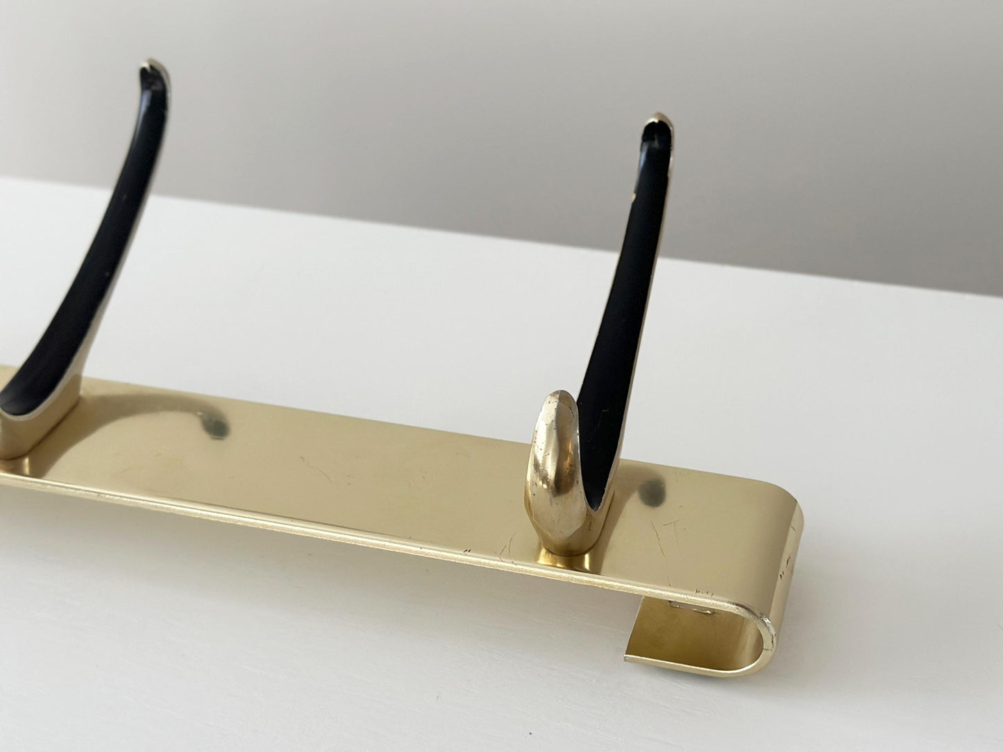 1960s – Mid-Century gold wall hooks coat rack with black accent with 3 hooks