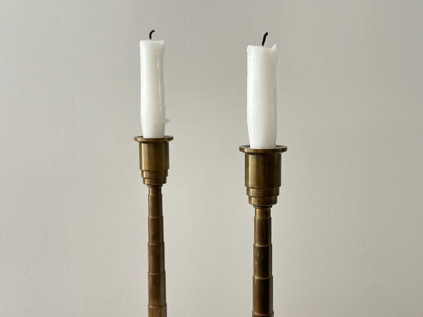 1930s – Pair of solid brass Art Deco candleholders with tiered stepped design