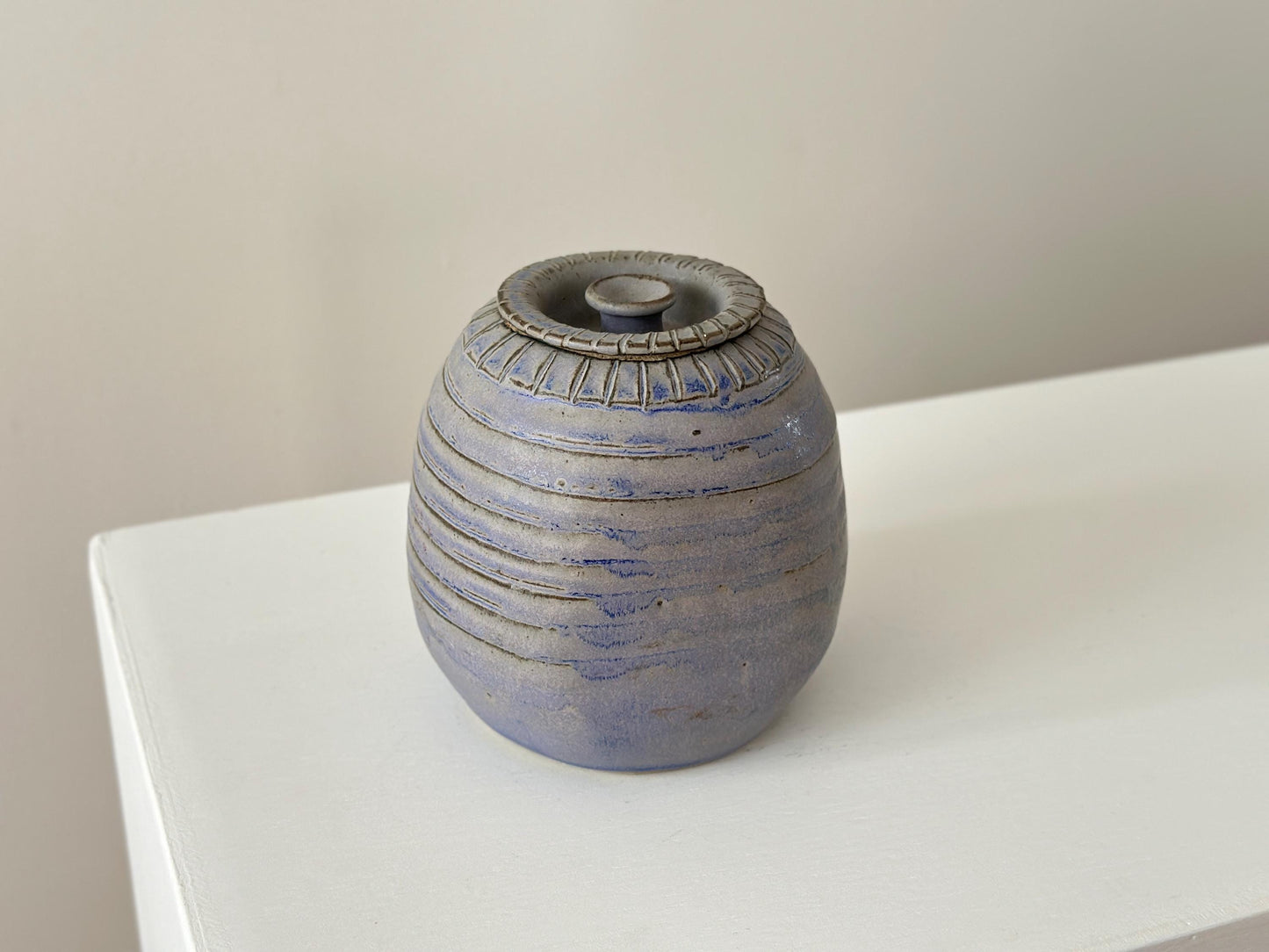 Vintage blue grey studio pottery jar with top, signed.