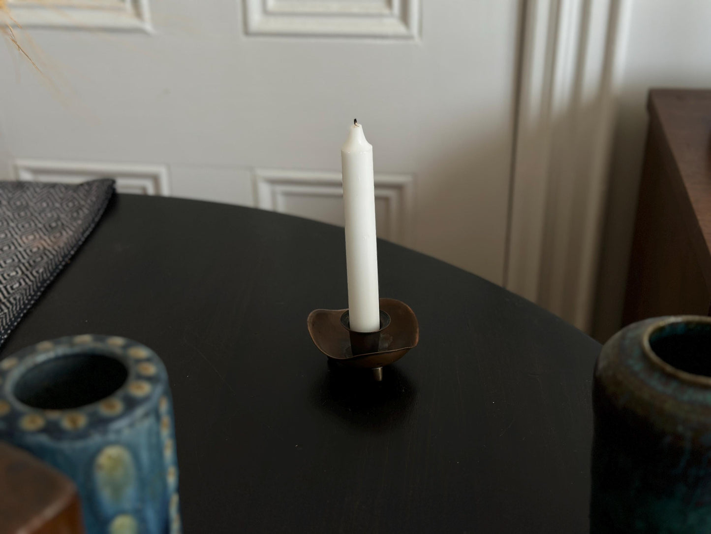 Pair of candlestick holders with heavy patina