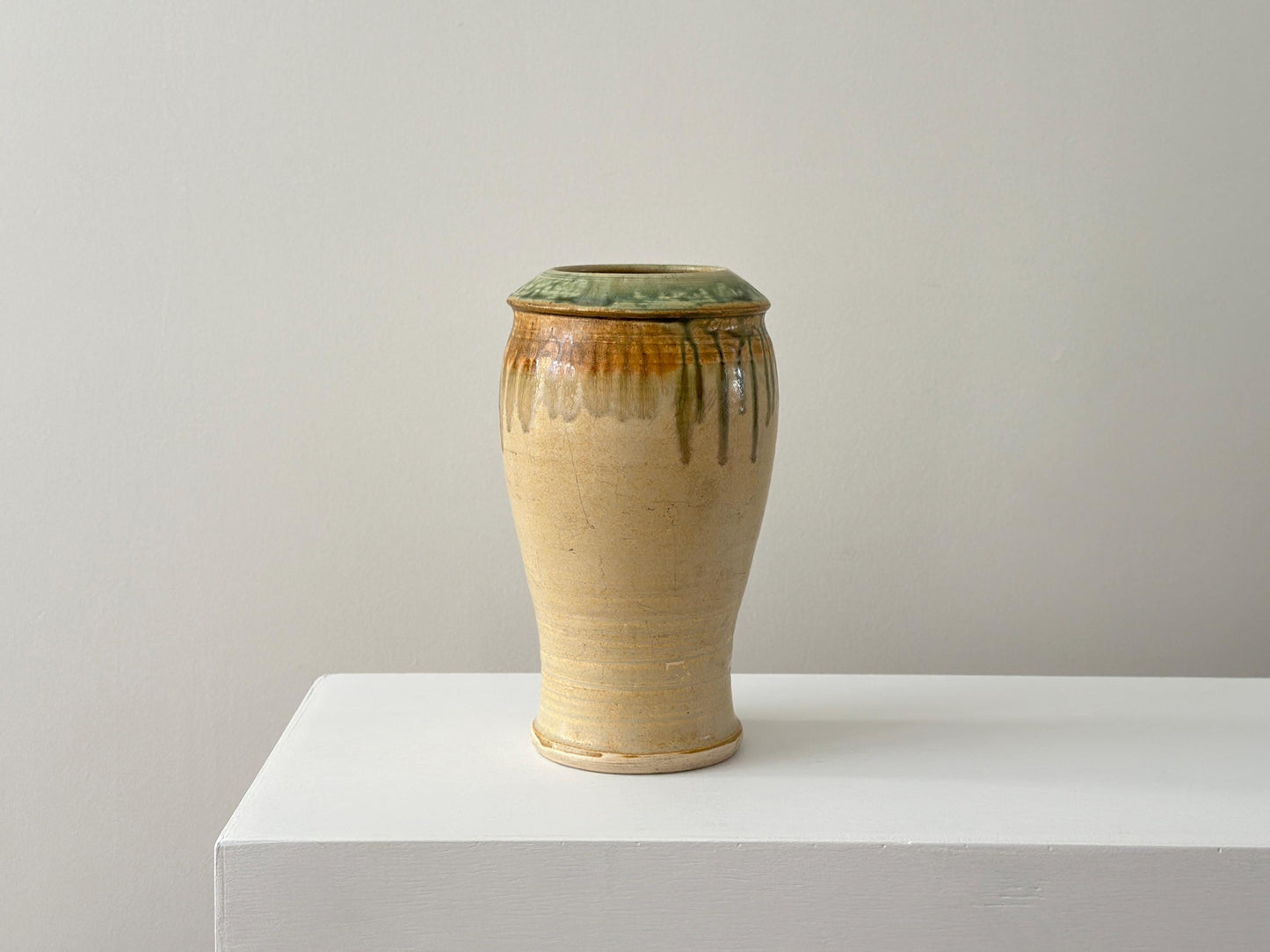 Vintage 10" studio pottery vase with green drip glaze and arts and crafts influence