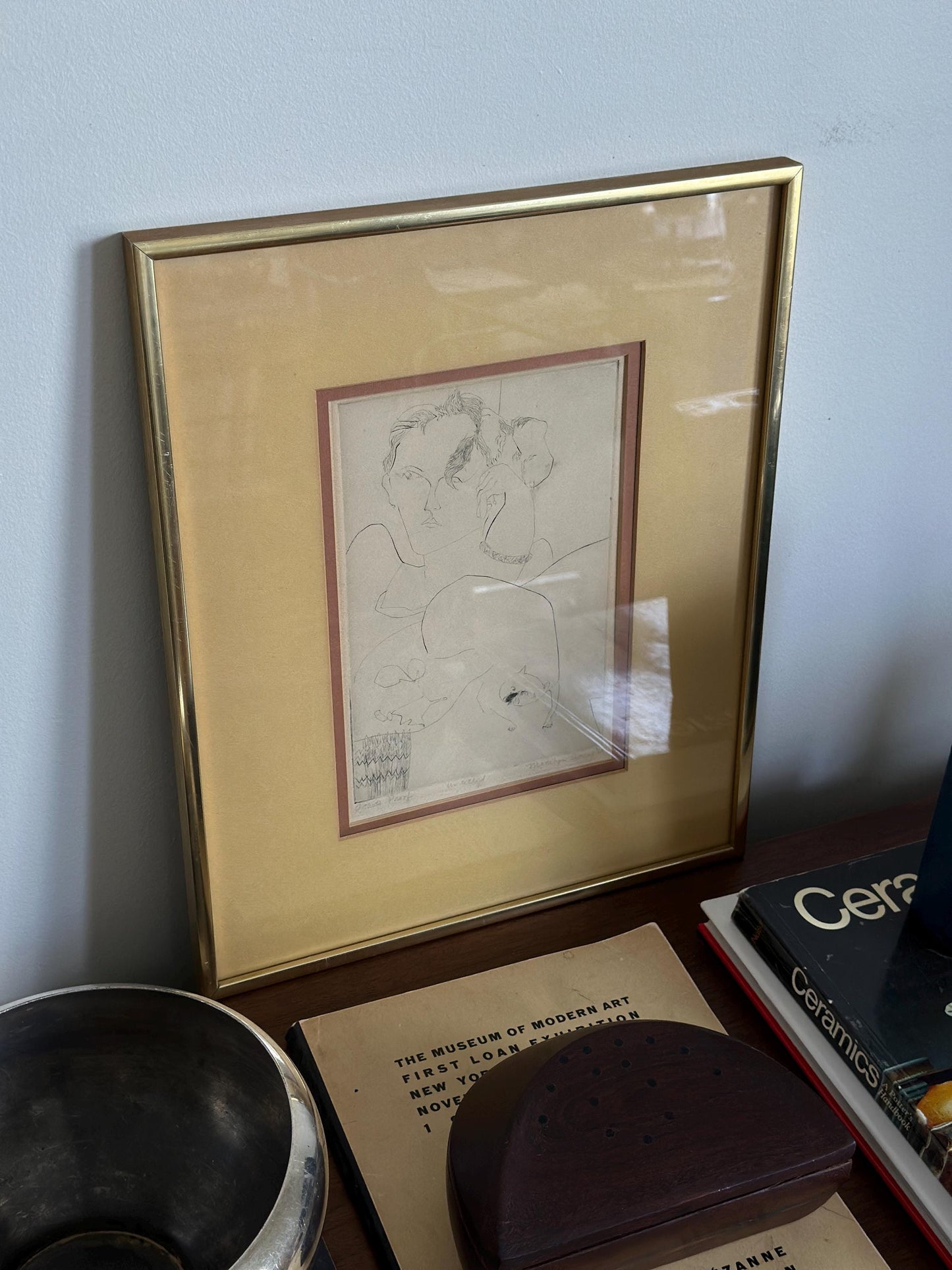 Signed artist proof illustration of a person and cat, framed and double matted