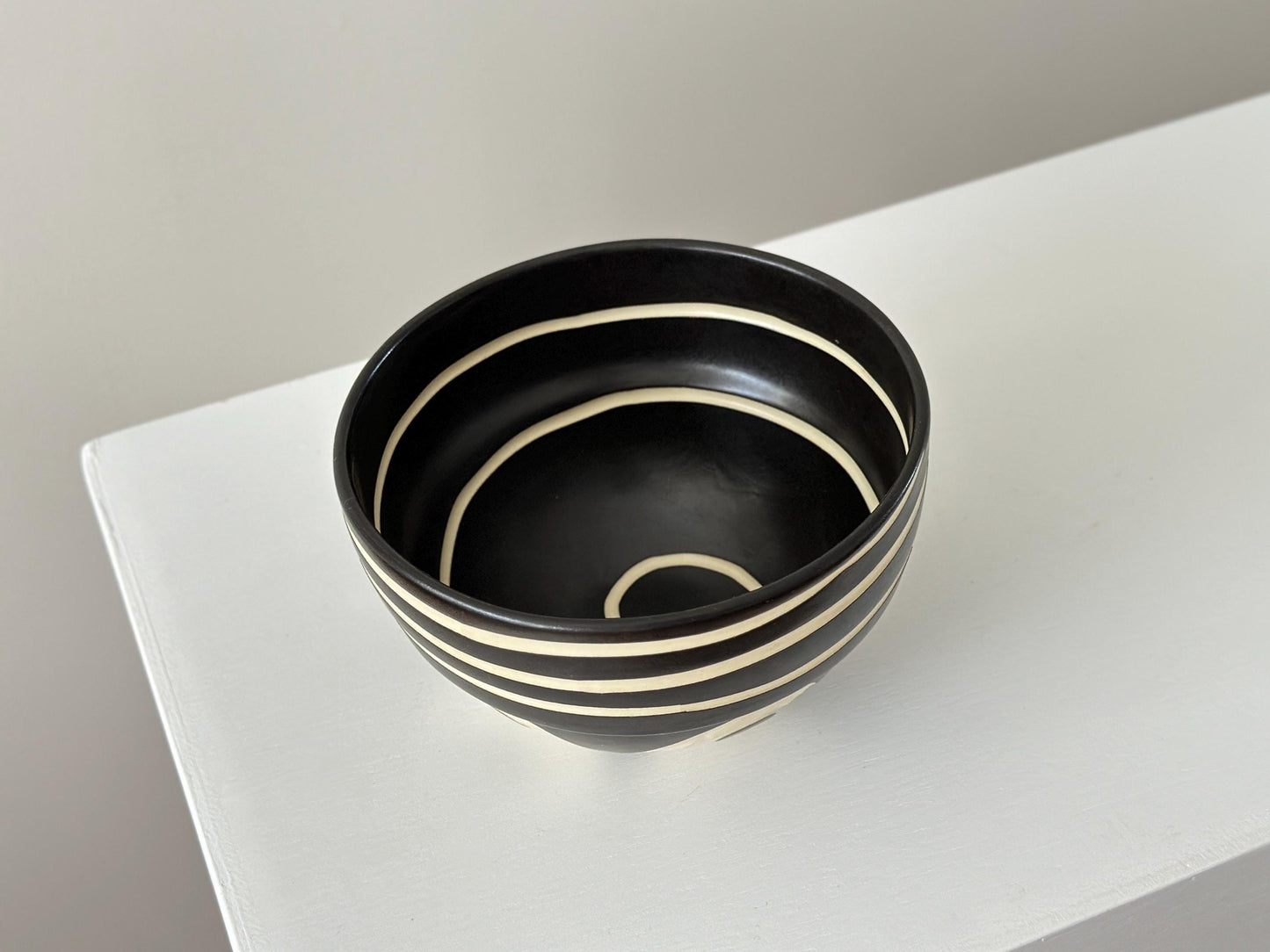 1993 – Ceramic bowl with high contrast geometric design by Kathy Erteman