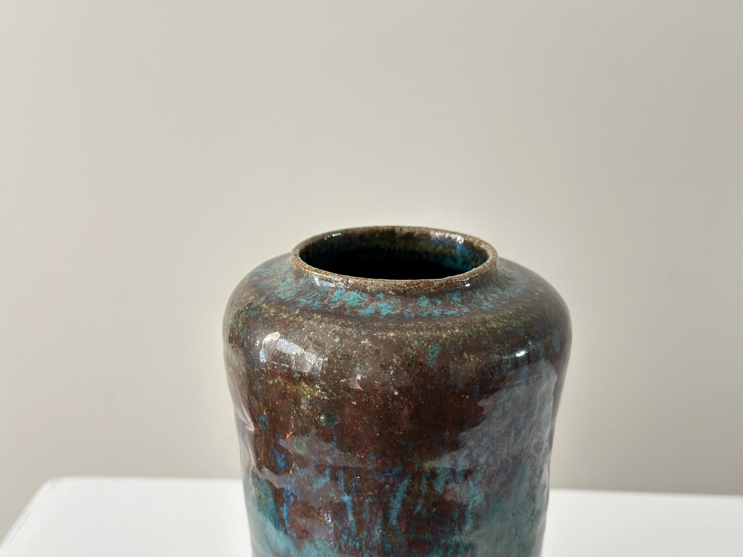 1980 – Signed studio stoneware vase with rich tones and verdigris glaze