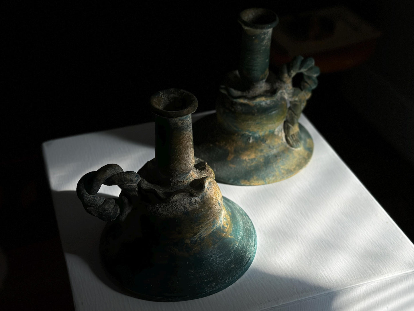Pair of vintage verdigris terracotta candlestick holders