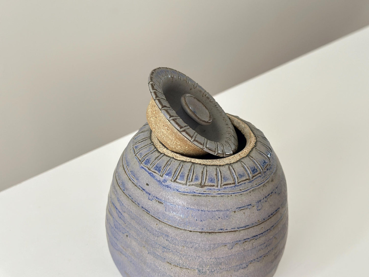 Vintage blue grey studio pottery jar with top, signed.