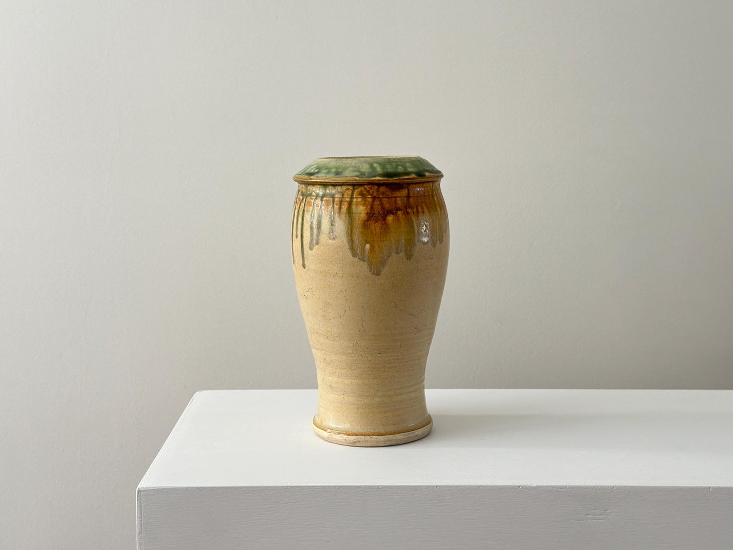 Vintage 10" studio pottery vase with green drip glaze and arts and crafts influence