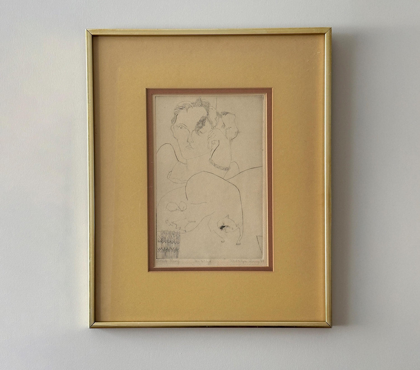 Signed artist proof illustration of a person and cat, framed and double matted