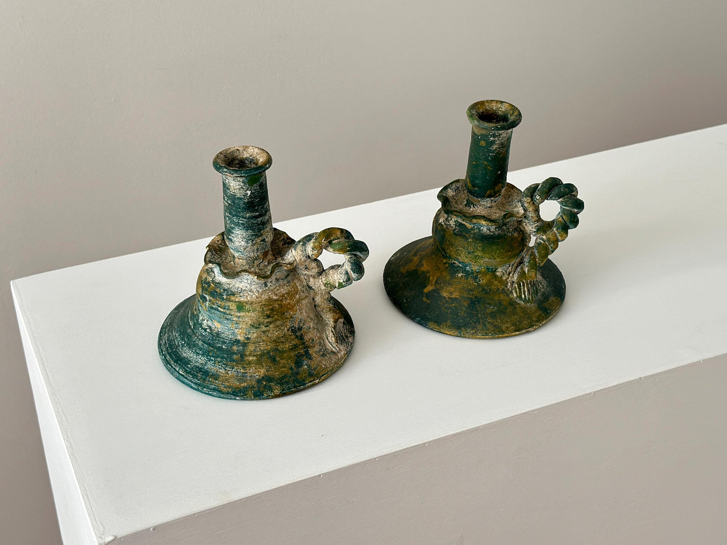 Pair of vintage verdigris terracotta candlestick holders