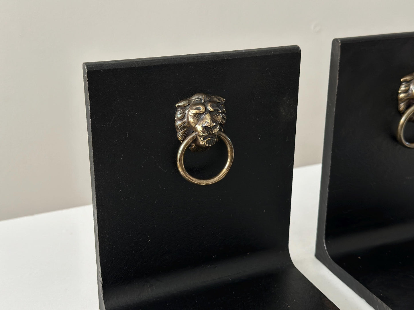 Vintage steel and brass lion head knocker bookends