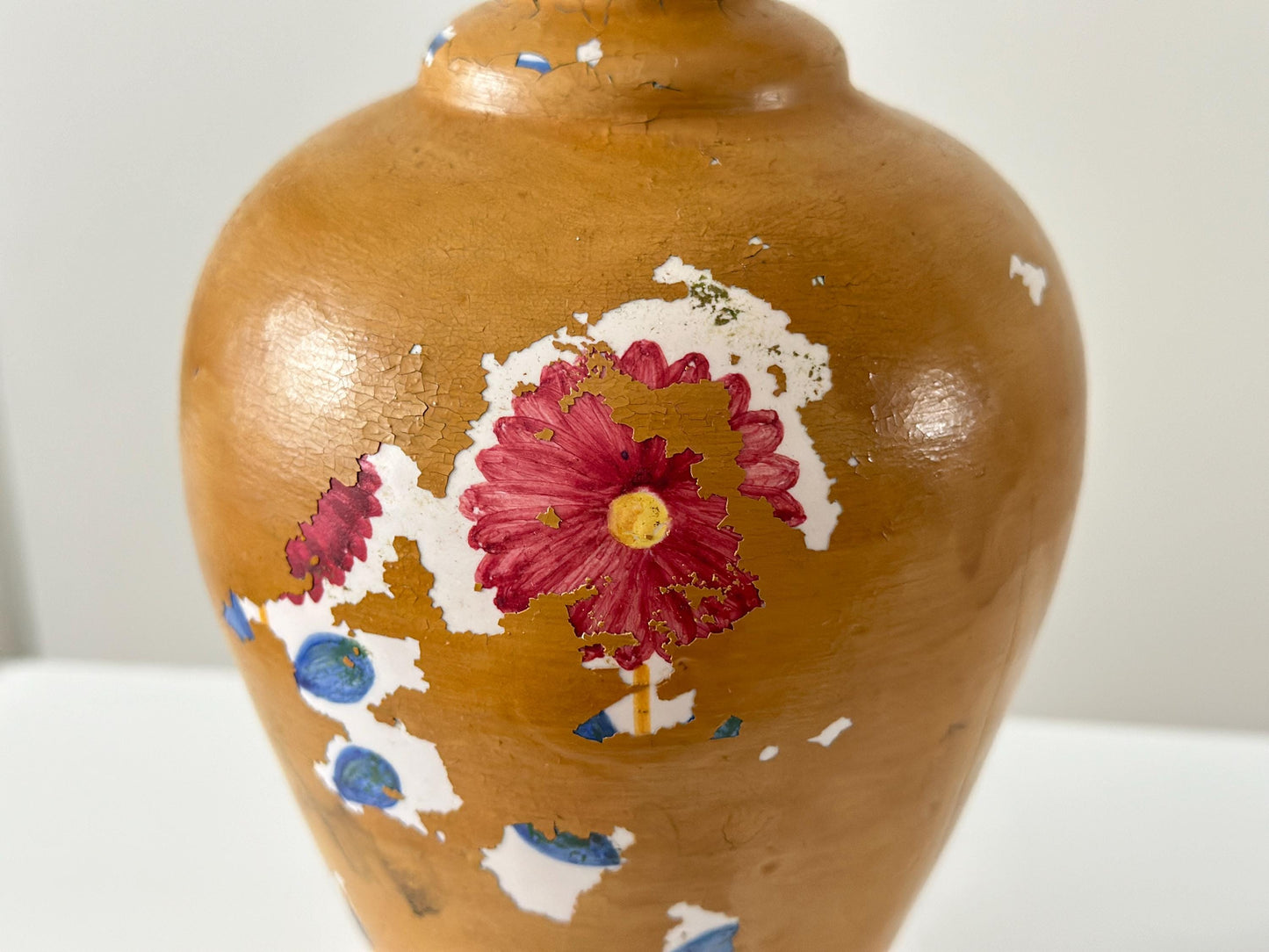 Antique porcelain lamp with weathered patina and chipped paint