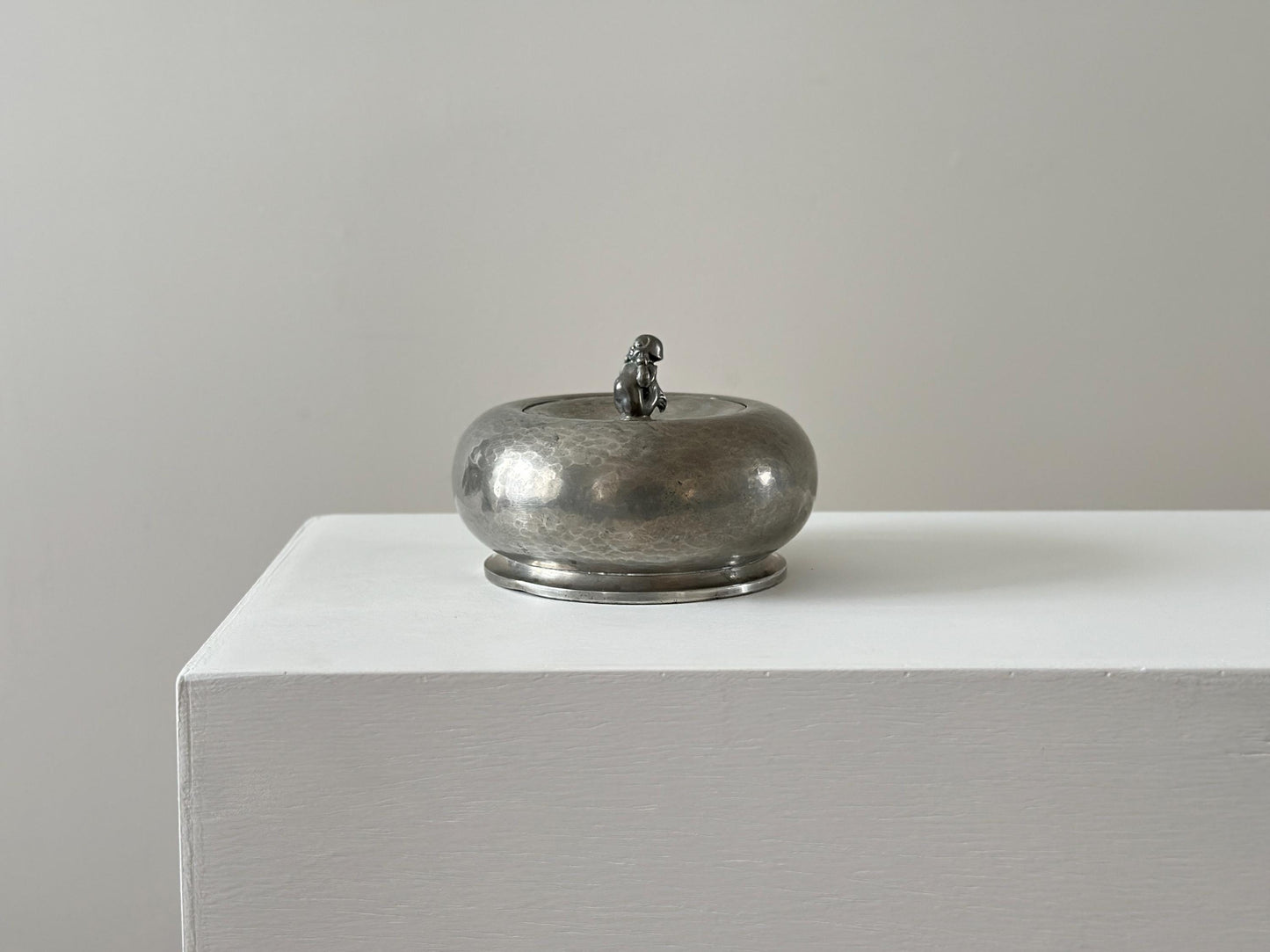 1920s – Danish rounded form hammered pewter box with merman lid