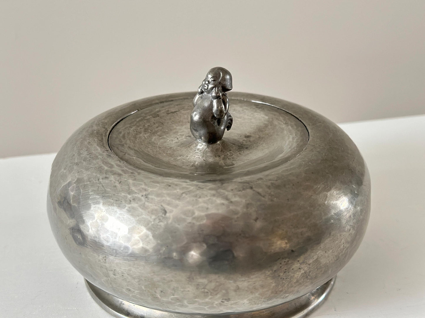 1920s – Danish rounded form hammered pewter box with merman lid