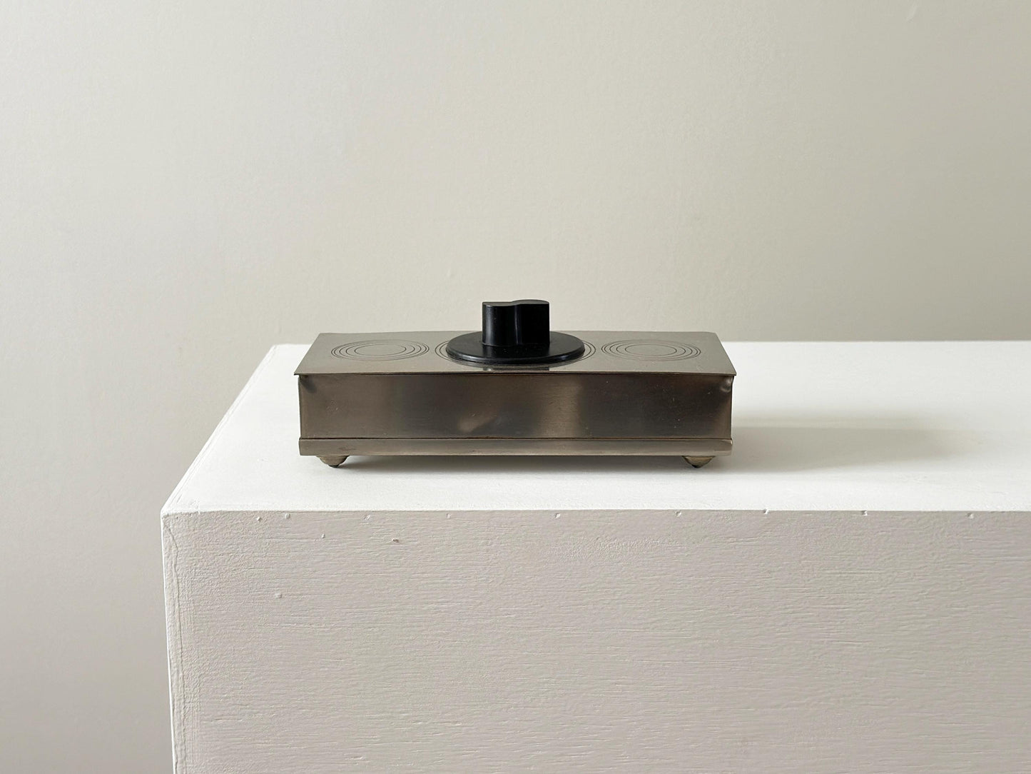 1934 – Art Deco nickel and bakelite cigarette box