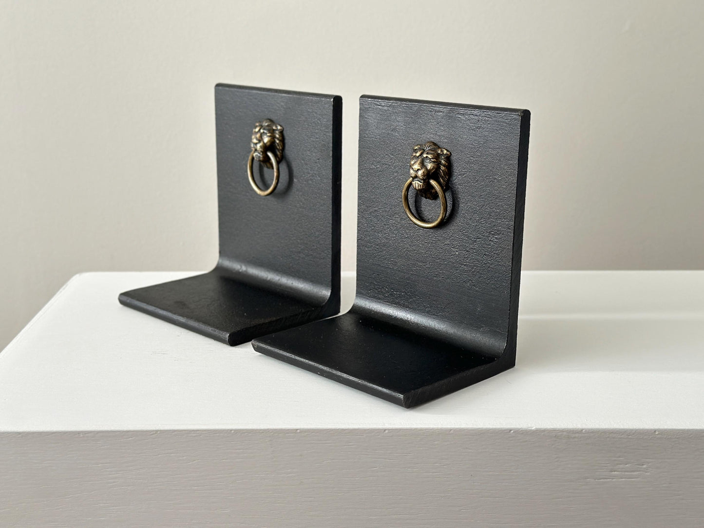 Vintage steel and brass lion head knocker bookends