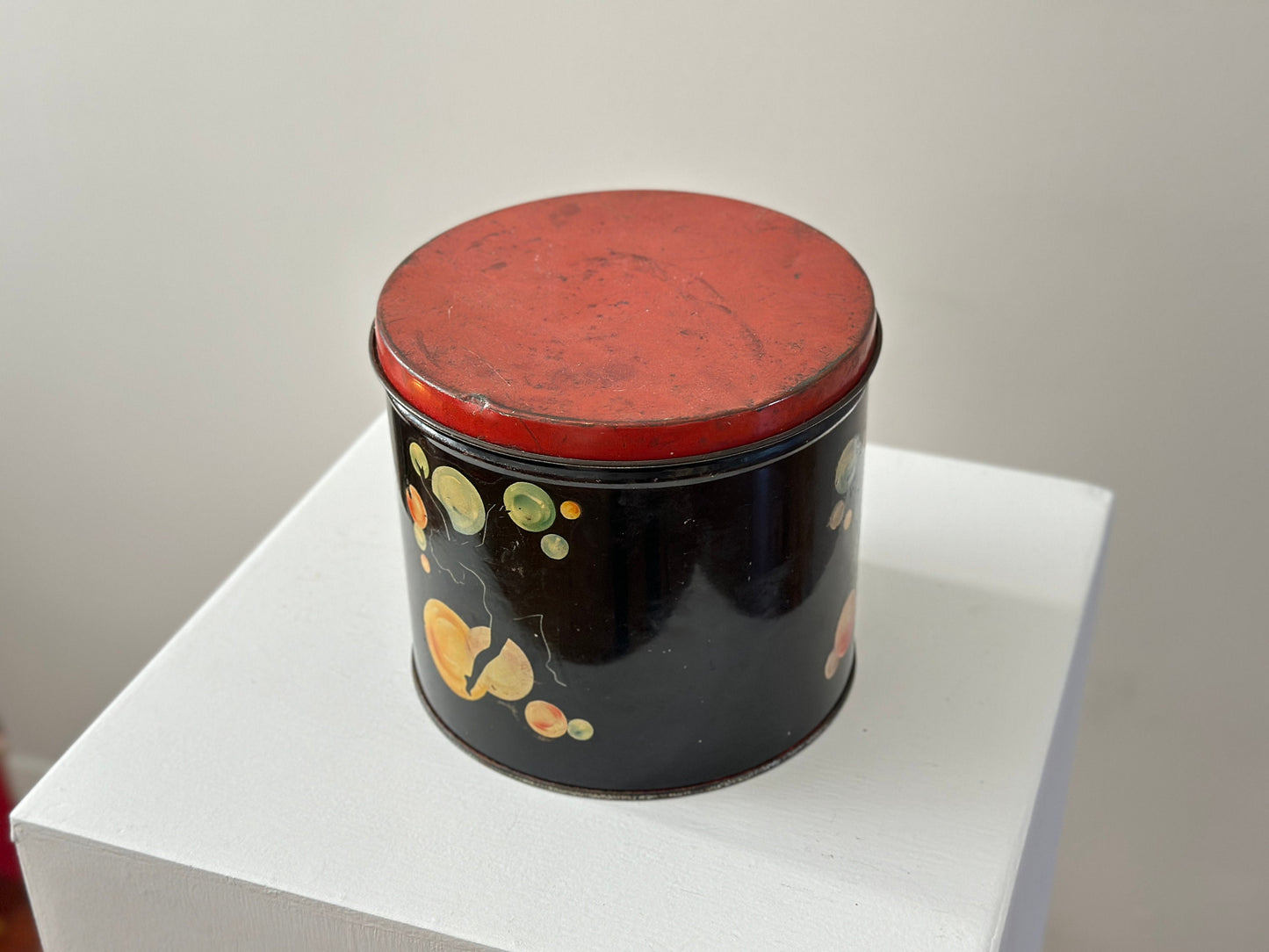 1940s – Tin canister with pinup dancer graphics