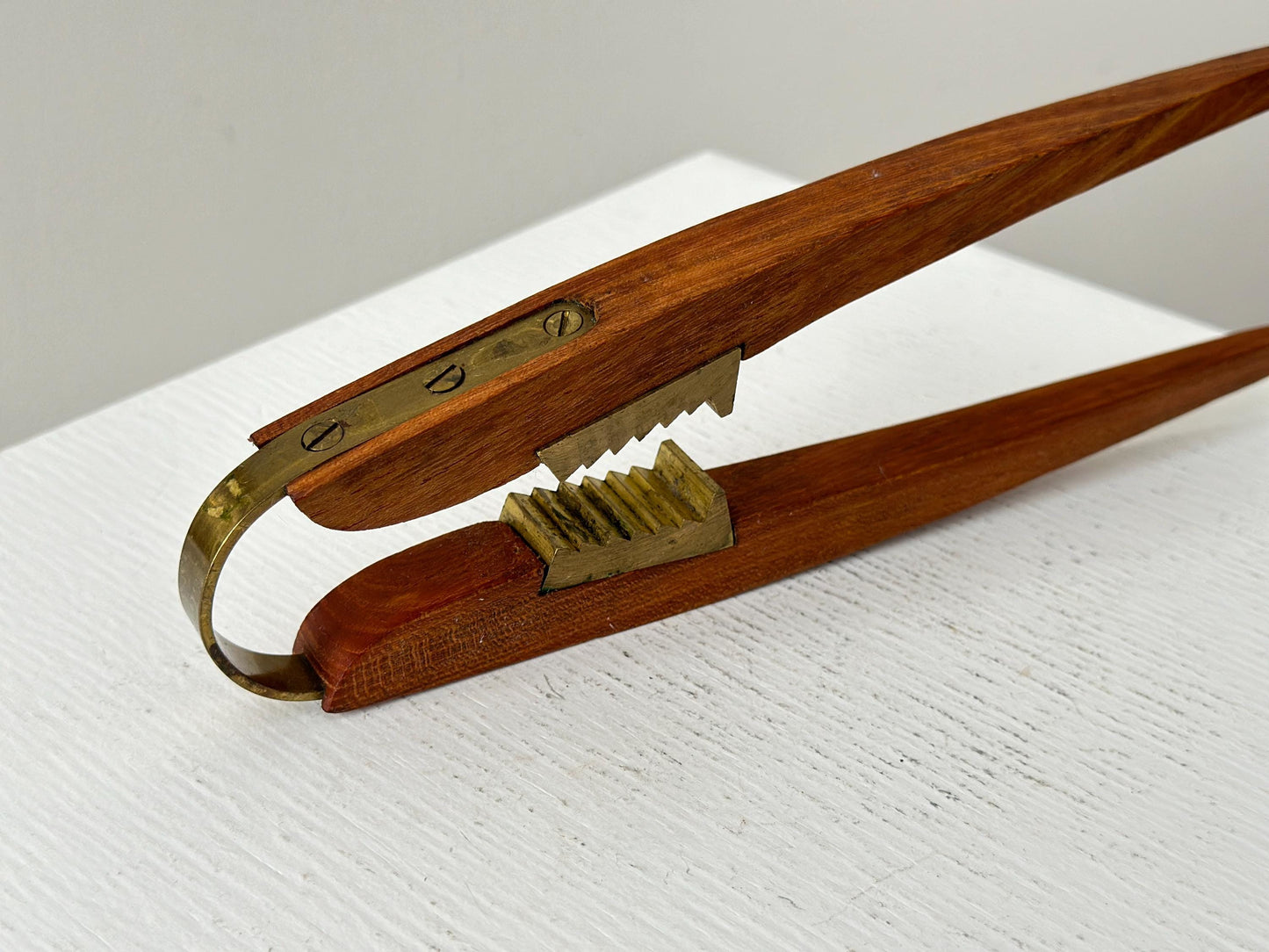 1950s – Danish teak and brass nutcracker by Poul Knudsen