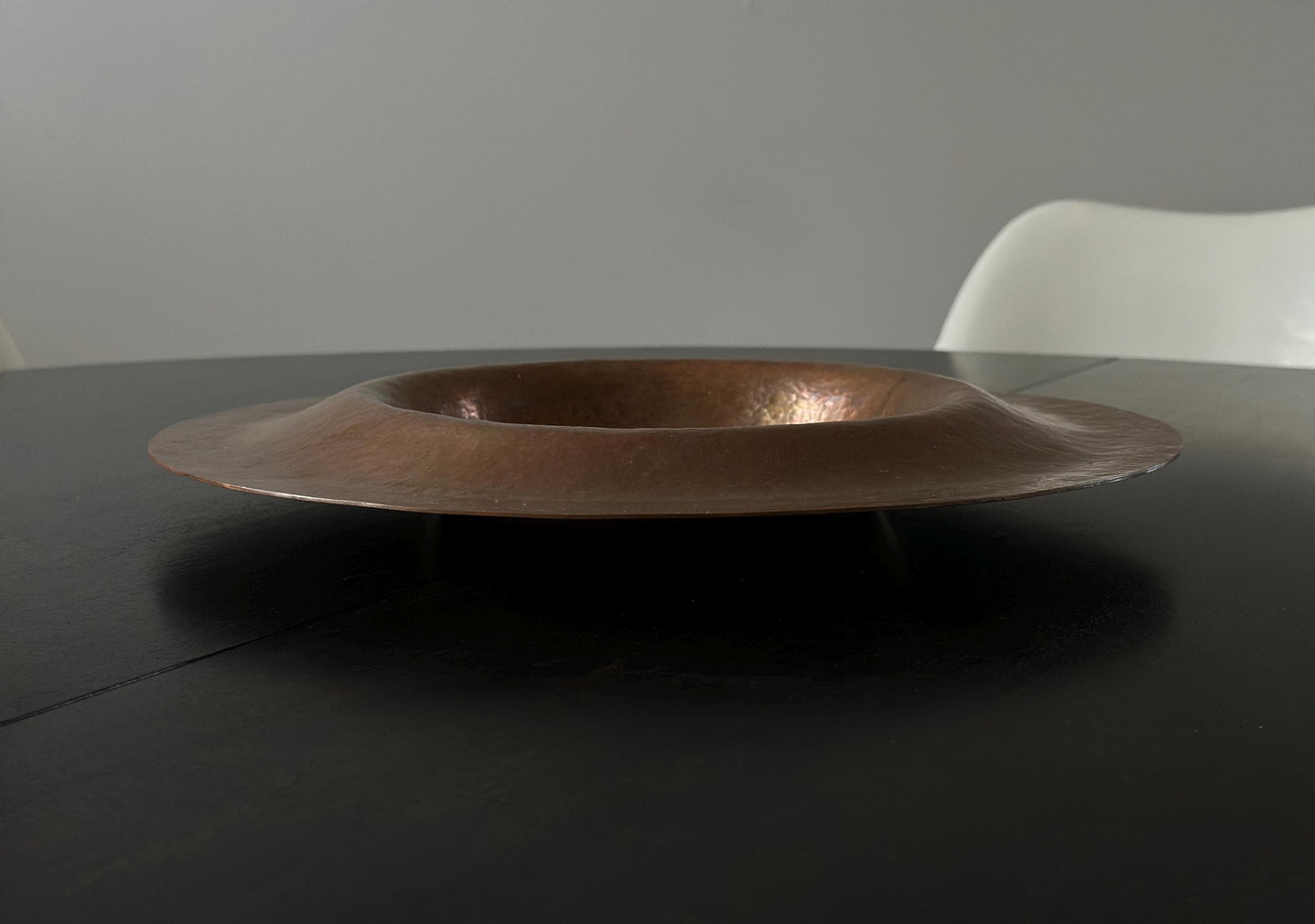 Vintage floating hammered copper centerpiece with a UFO like shape