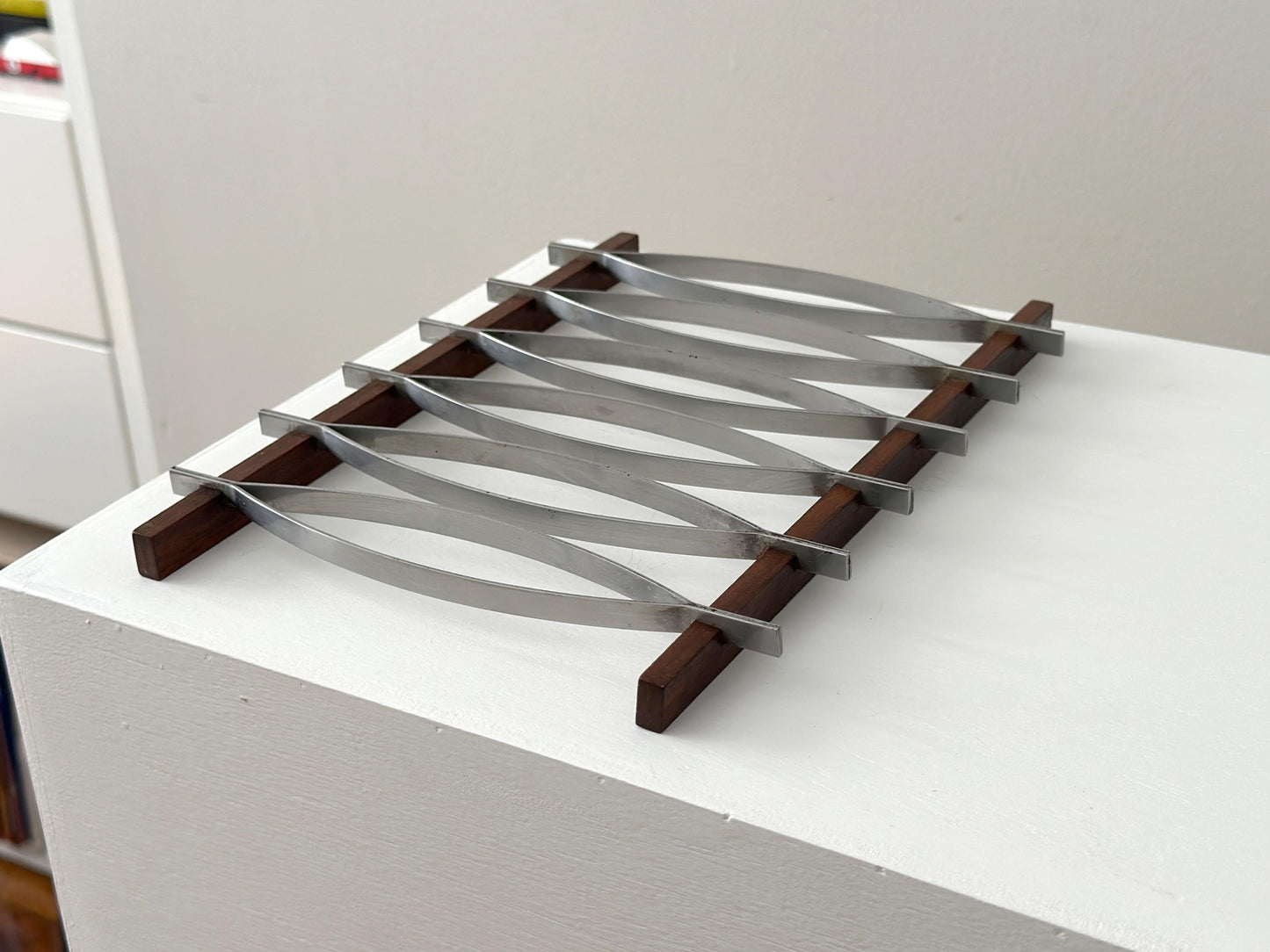 1960s – Mid-Century Brazilian stainless steel and rosewood trivet by Hercules