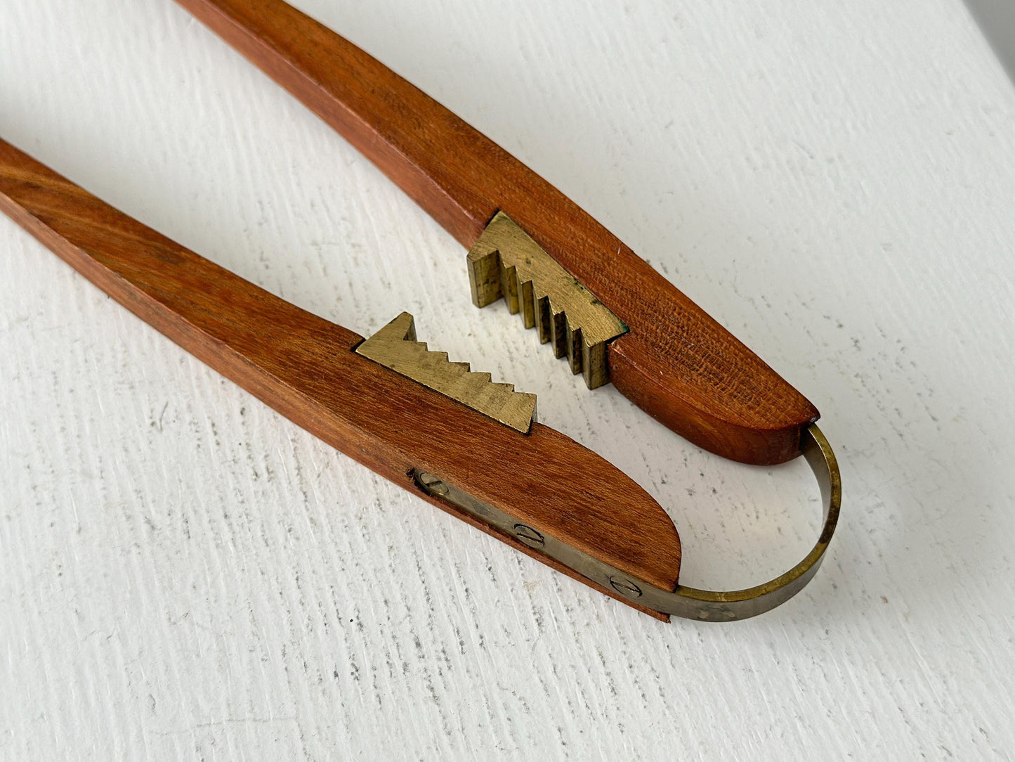 1950s – Danish teak and brass nutcracker by Poul Knudsen