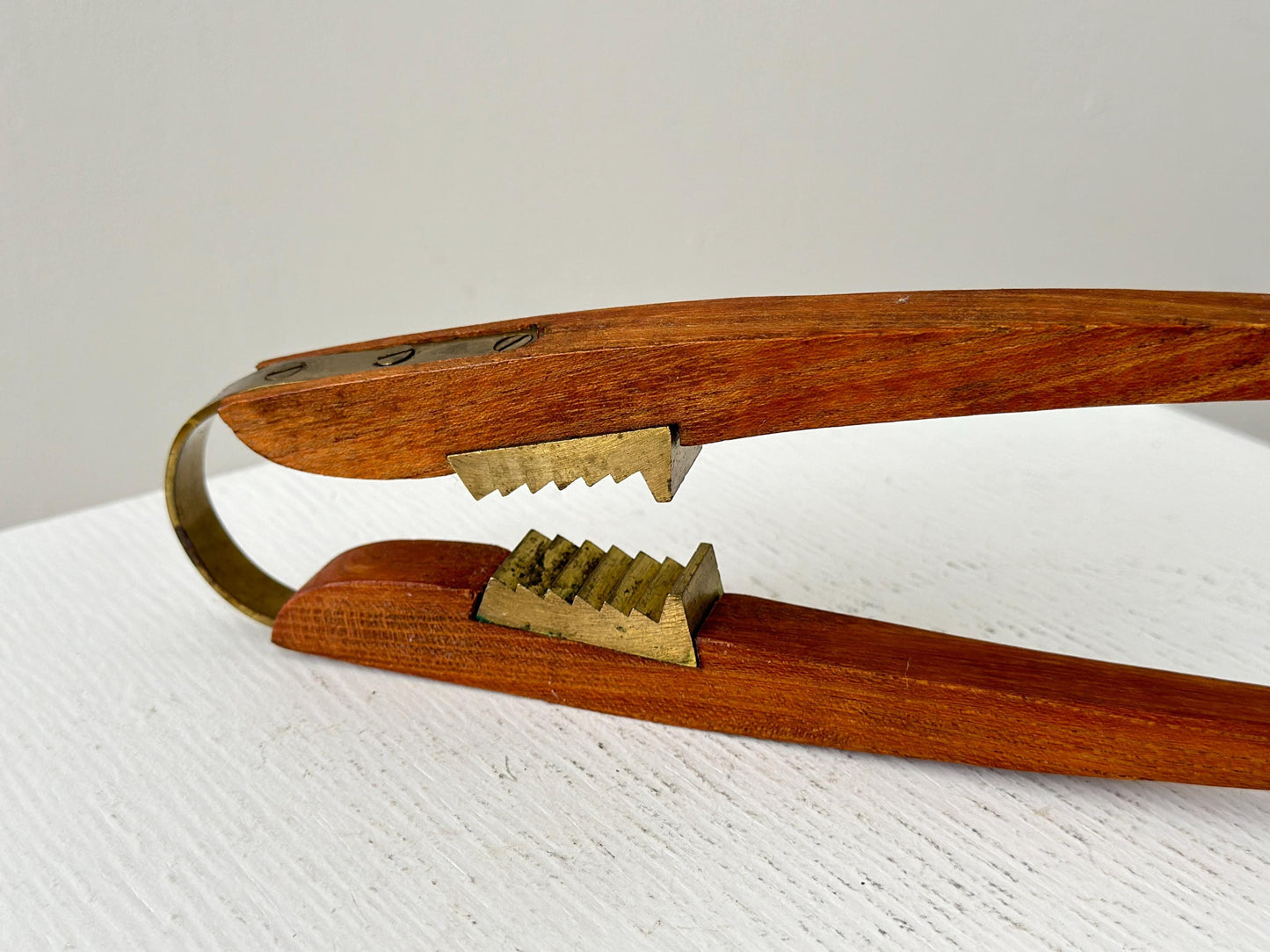 1950s – Danish teak and brass nutcracker by Poul Knudsen