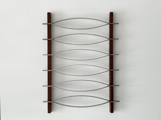 1960s – Mid-Century Brazilian stainless steel and rosewood trivet by Hercules