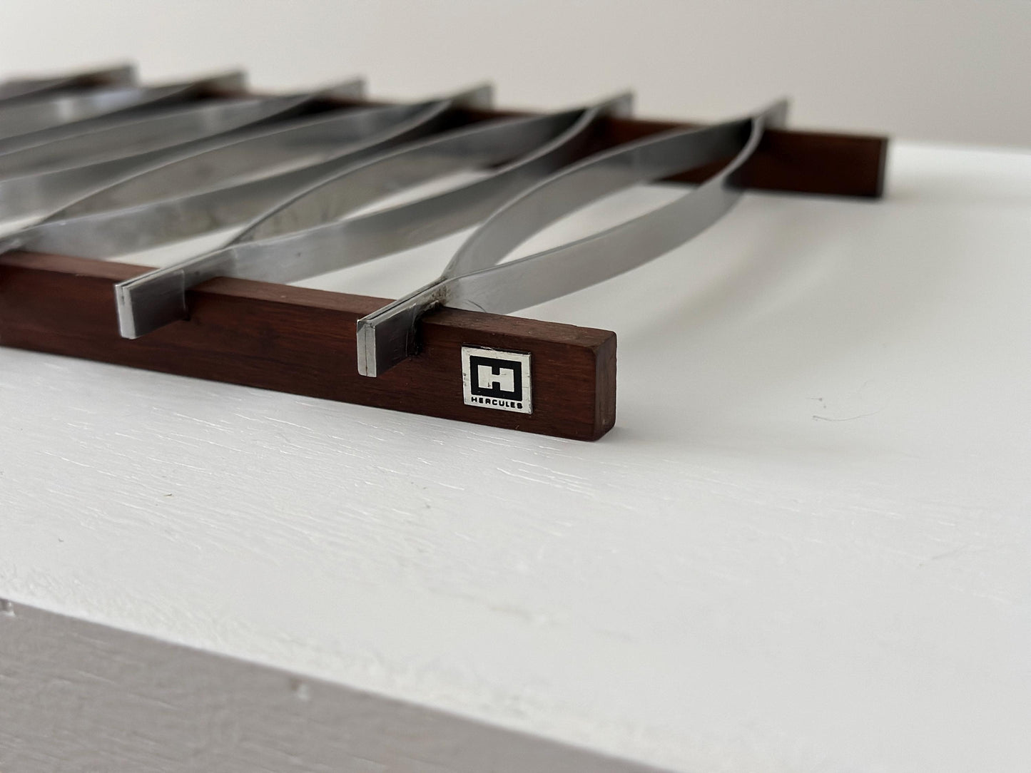 1960s – Mid-Century Brazilian stainless steel and rosewood trivet by Hercules