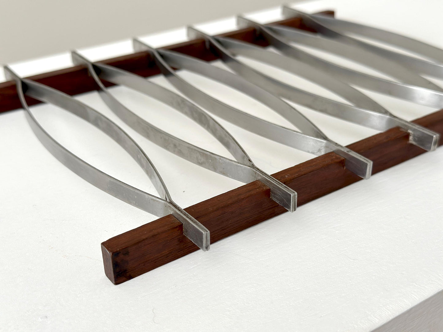 1960s – Mid-Century Brazilian stainless steel and rosewood trivet by Hercules