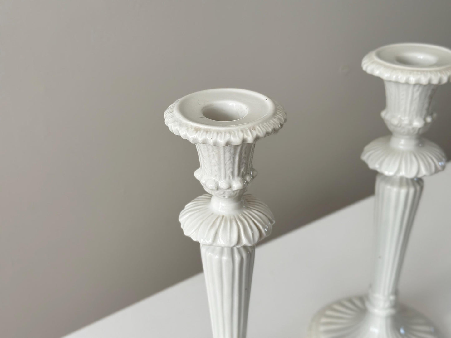 1959 – Pair of Mid Century Italian neoclassical Corinthian column white glazed ceramic candlesticks imported by Bonwit Teller