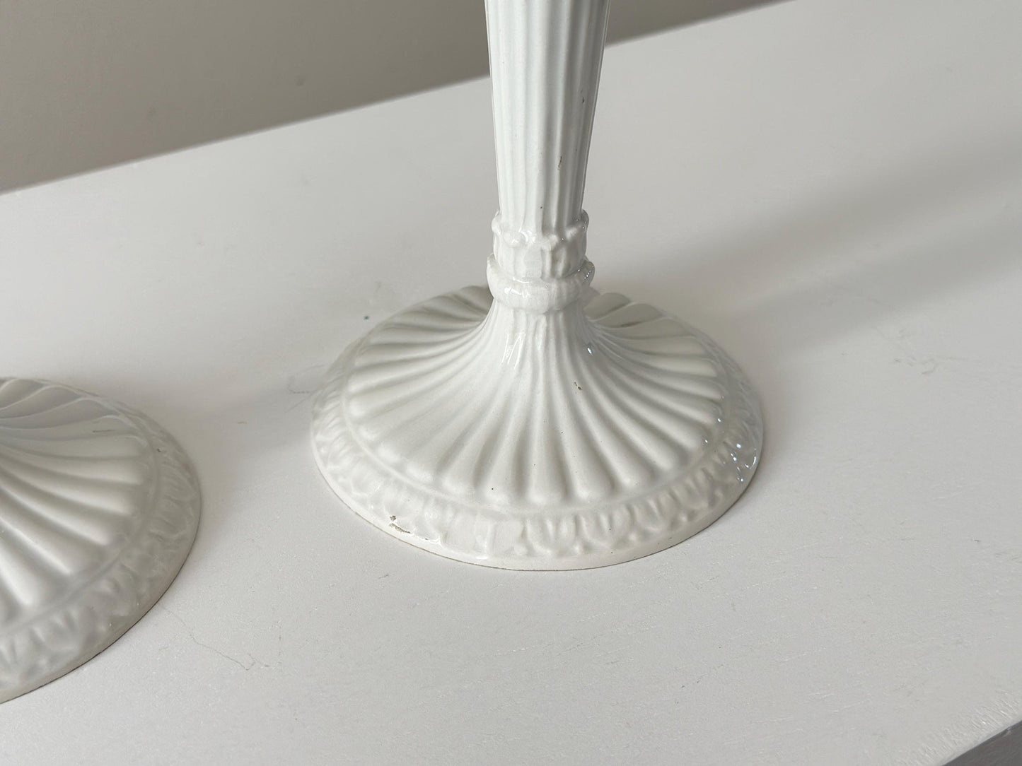 1959 – Pair of Mid Century Italian neoclassical Corinthian column white glazed ceramic candlesticks imported by Bonwit Teller