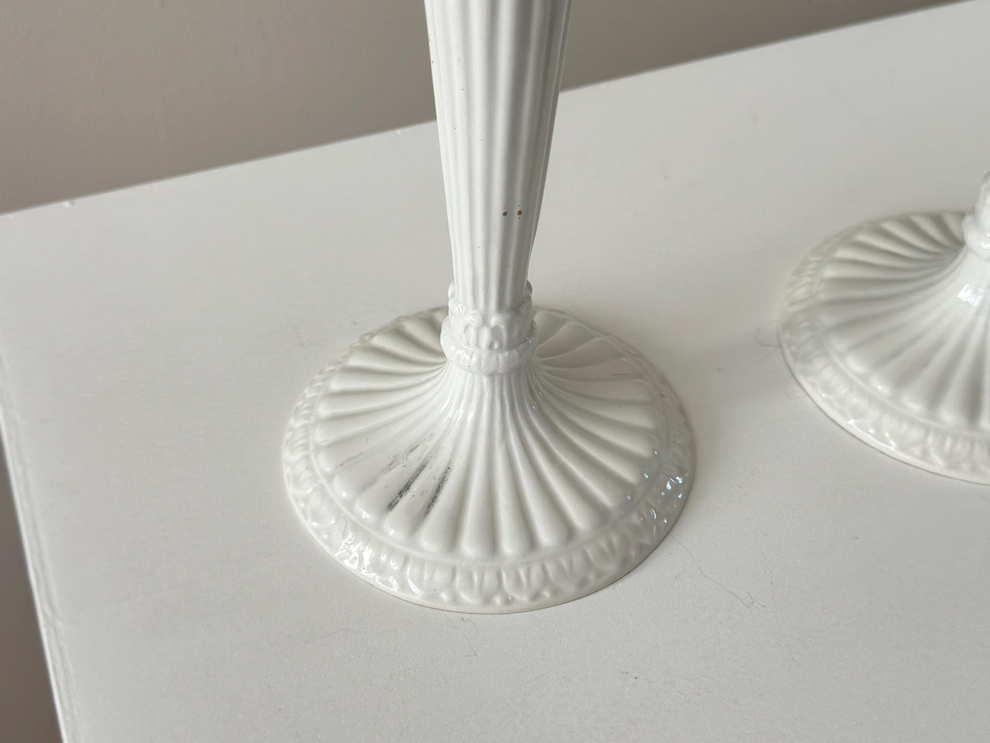 1959 – Pair of Mid Century Italian neoclassical Corinthian column white glazed ceramic candlesticks imported by Bonwit Teller