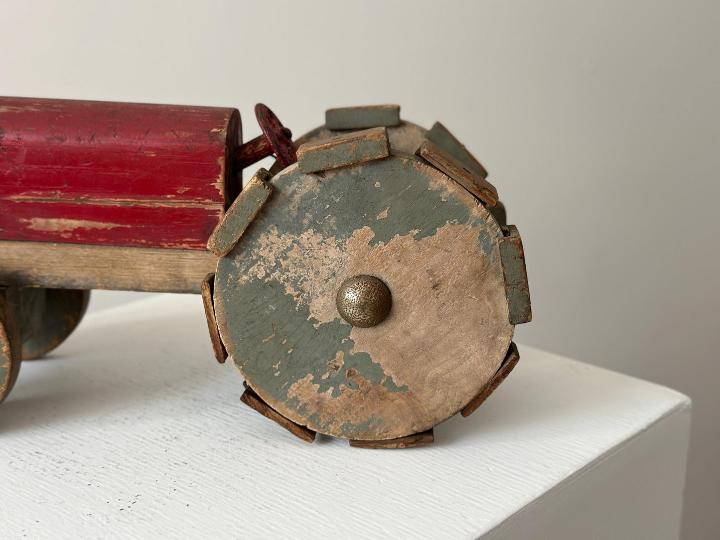 1930s – Primitive folk art toy tractor with red paint and cleated wheels