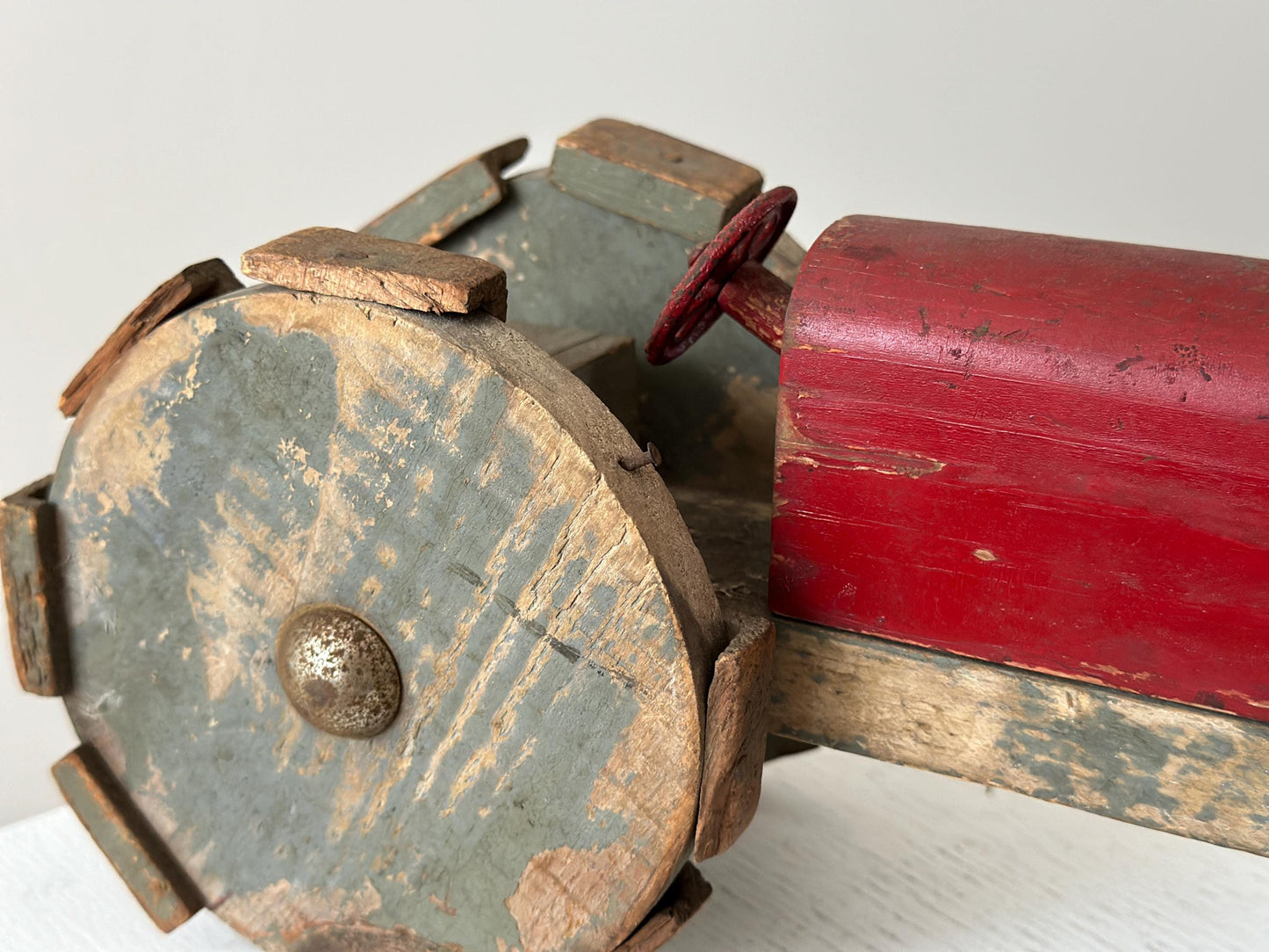 1930s – Primitive folk art toy tractor with red paint and cleated wheels