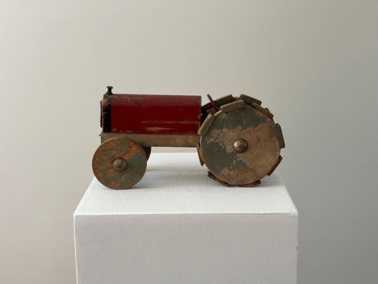 1930s – Primitive folk art toy tractor with red paint and cleated wheels