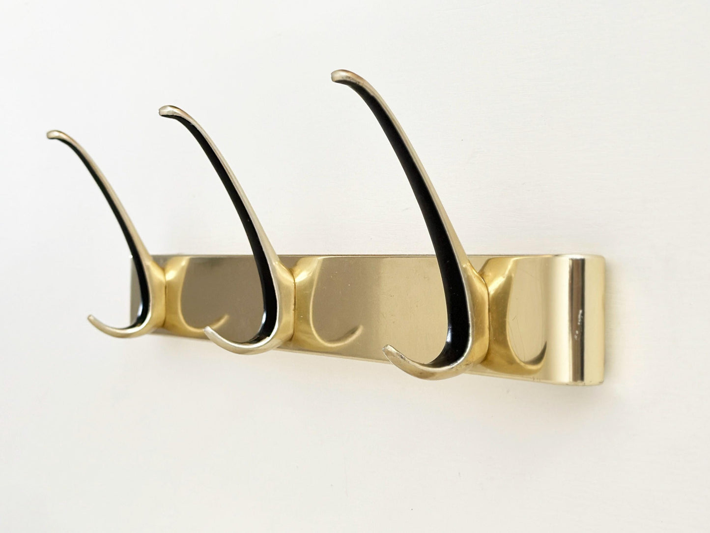 1960s – Mid-Century gold wall hooks coat rack with black accent with 3 hooks
